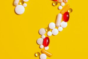 medication pills on yellow background