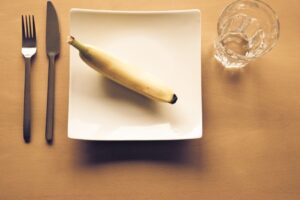 white bread on white ceramic plate beside clear drinking glass